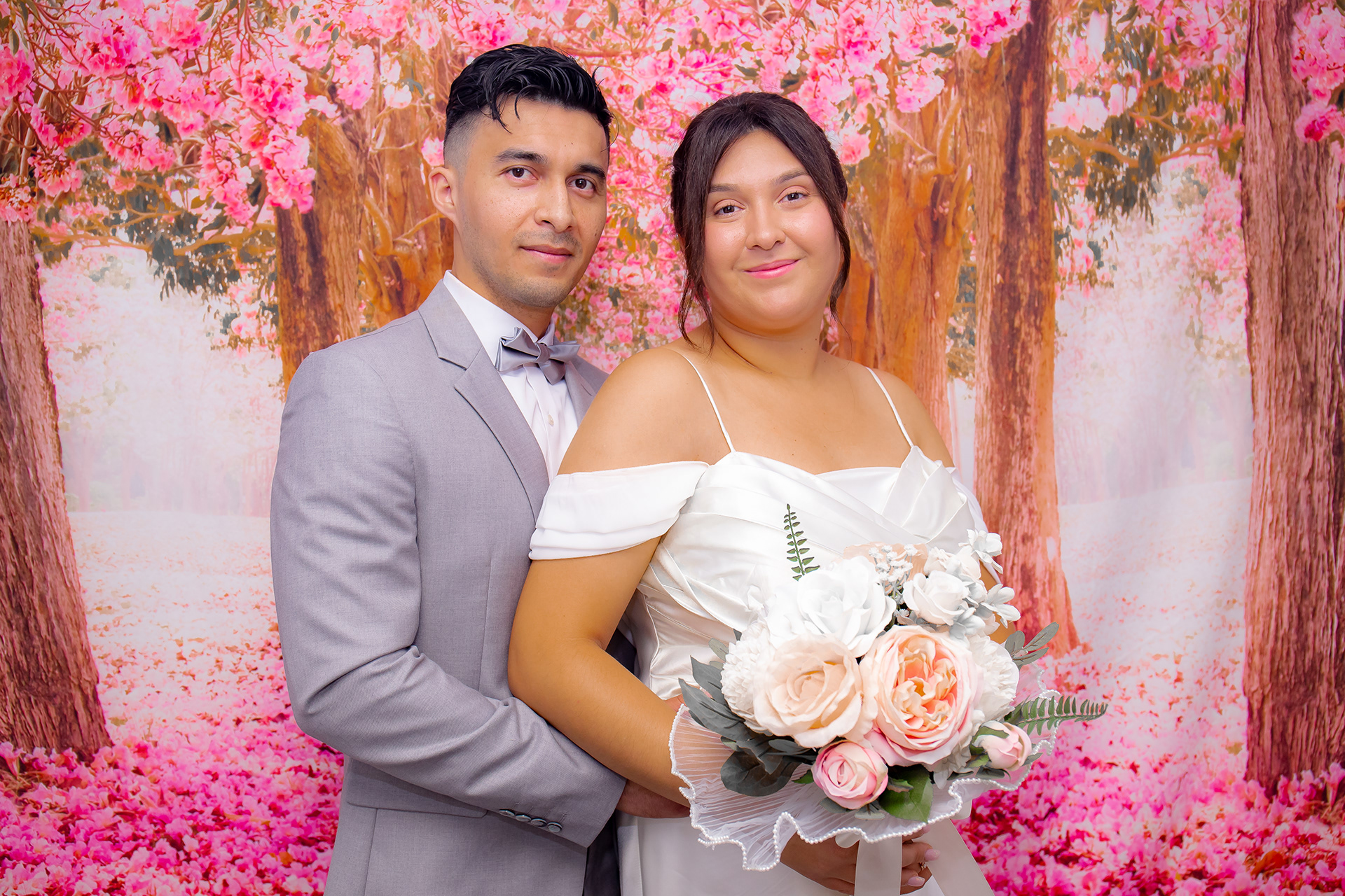Wedding portrait with pink flowering trees