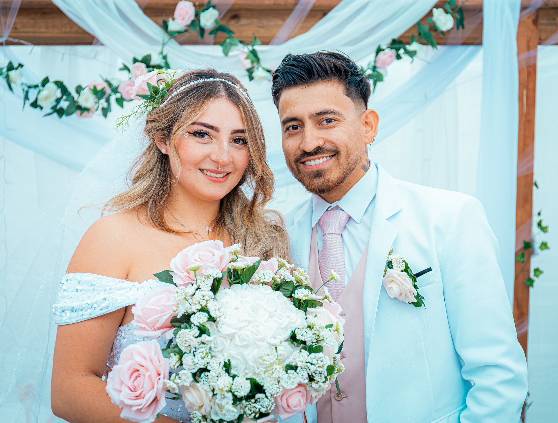 Newly married couple holding flowers